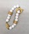 Modern Vintage 1980s Signed Givenchy Goldtone & White Resin Leaf Toggle Bracelet For Sale - Image 3 of 8
