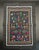 This beautiful Hmong embroidered story cloth, also known as Paj Ntaub, features various animals and human figures and a...