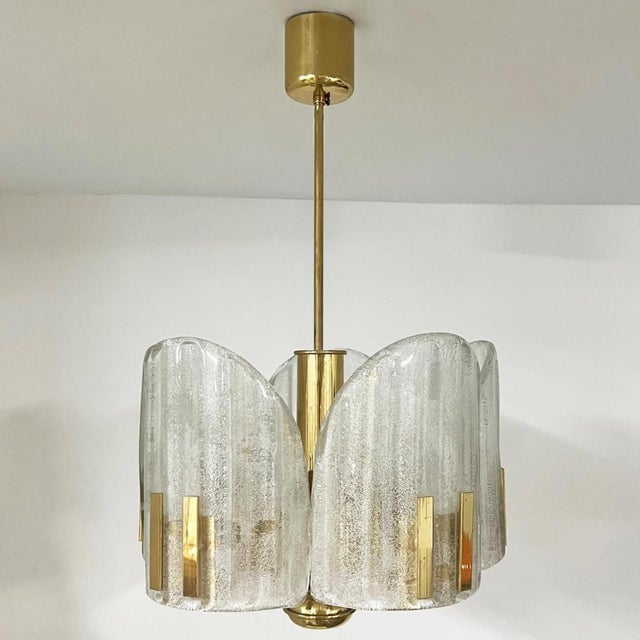 Charming chandelier in the style of fagerlund, sweden. From around 1960. Consists of five crystal handmade glass cylinders...