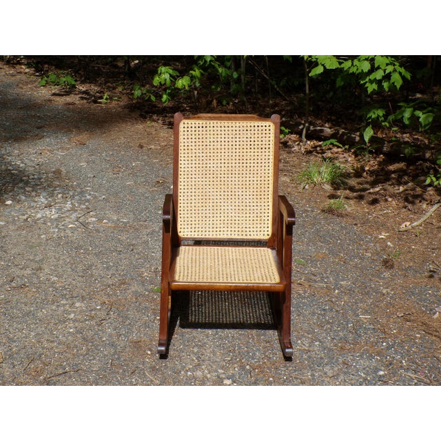Vintage Mid Century Child Size Small Rocking Chair Rocker with solid Walnut frame and caned seat and back. Dimensions:...