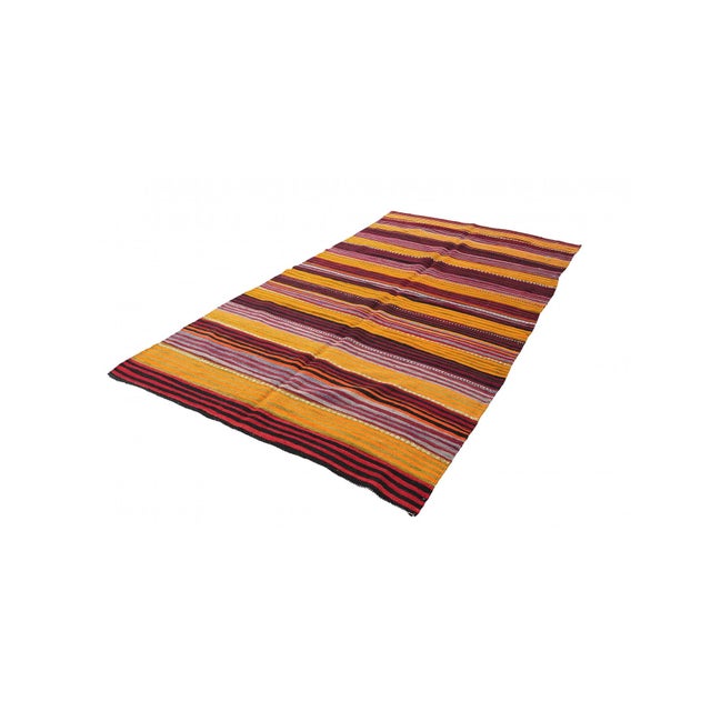 Handwoven vintage striped decorative kilim rug from Denizli region of Turkey. Approximately 50-60 years old. In very good...