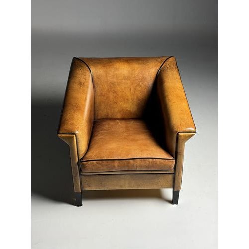 Set of two sheepskin club chairs/armchairs. Art Deco style. Approximately 30 years old, made by the Dutch brand Lounge...