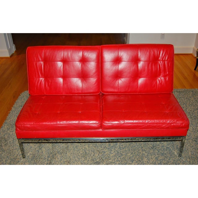 1960s tufted armless Knoll sofa with Knoll tag. Very stylish - the classic Knoll lines really pop in Lipstick Red Leather...