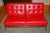 1960s tufted armless Knoll sofa with Knoll tag. Very stylish - the classic Knoll lines really pop in Lipstick Red Leather...