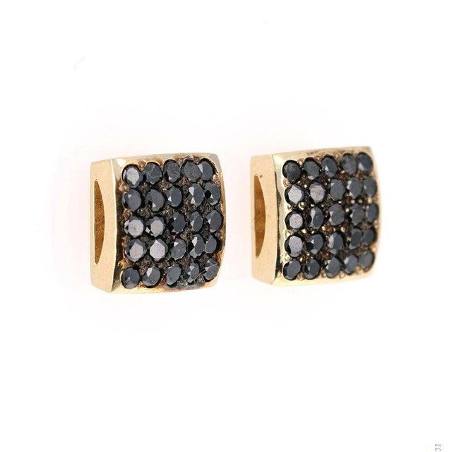 These earrings have 1.38 carats of Natural Round Cut Black Diamonds. They are curated in 14 Karat Yellow Gold and weigh...