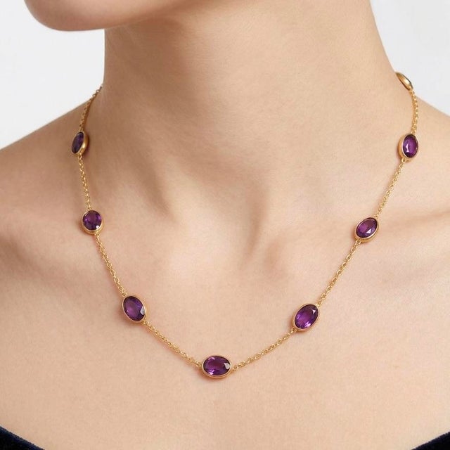 Amethyst Station Necklace – February Birthstone This elegant necklace showcases a series of vibrant amethyst gemstones,...