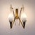 This set of three wall sconces was made in Italy in the 1960s and features a period-defining design, clearly inspired by...