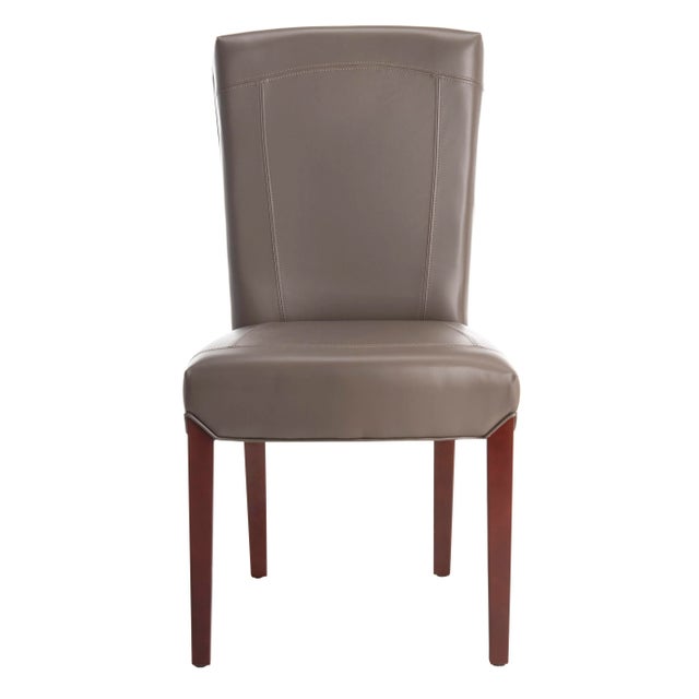 Clay-colored leather and a cherry mahogany finish on the legs give the side chair a masculine edge that's softened just...