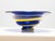 This decorative glass bowl dates to the 1960s and exemplifies mid-century art glass through its expressive use of color...