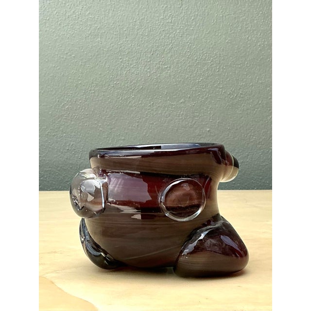 This exquisite vintage art glass bowl is a pensive testament to the organic modernism of the mid-20th century. Expertly...