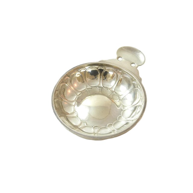 A French .950 silver tastevin made by the prestigious Puiforcat with thumb rest. Pronounced “taht-vahn”, and translating...