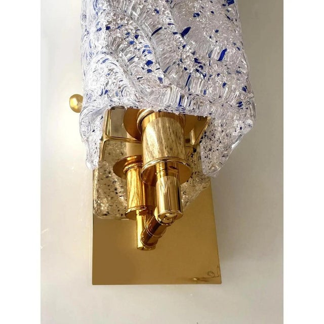 Contemporary rectangular wall sconces made in clear and blue “graniglia” murano glass - set of two the metal frame in a...