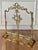 20th century Louis XVI style brass fireplace screen. It is adorned with a central medallion with a pair of doves...