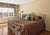 Elevate your primary suite with this magnificent, heirloom-quality King-size brass bed frame by the renowned Elliott’s...