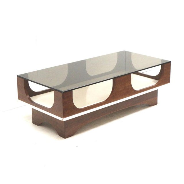 Space Age vintage coffee table with a smoked glass and wenge wood top from the 1970s. Width: 129.5 cm Depth: 60 cm Height:...
