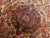 Vintage Persian rug. Rich in tone. Wool pile on cotton foundation. Floral pattern with intricate central medallion.