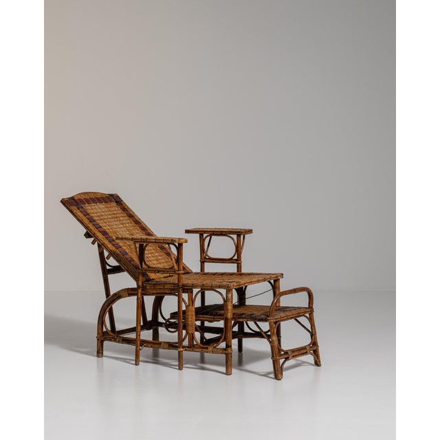 A natural bamboo lounge chair, dating to the 19th century and made in France. The bamboo frame is finished in rattan,...
