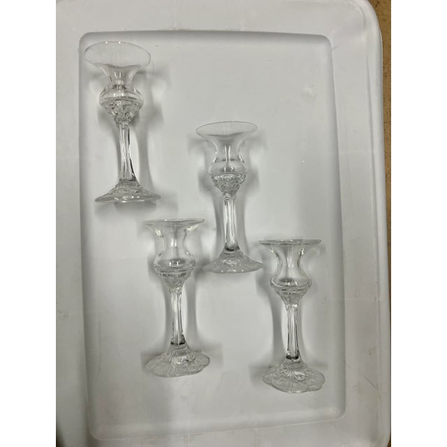 Single clear blown glass candle light holder. Stemmed glass each is 6” tall with a rose pattern . The pattern is called...
