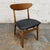 A set of four vintage Danish dining chairs by Farstrup, Model 210, dating to the 1950s. Each chair pairs a broad, gently...