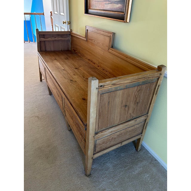 Wooden bench opens to a daybed.