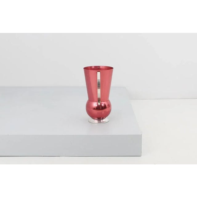 Beautiful umbrella stand with double handle, in fuchsia and silver anodized aluminum, with "Rinnovel Italia" brand on the...