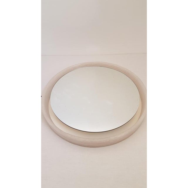 Round mirror with an acrylic edge that looks like ice glass. The mirror has 5 light points on the back, which illuminates...