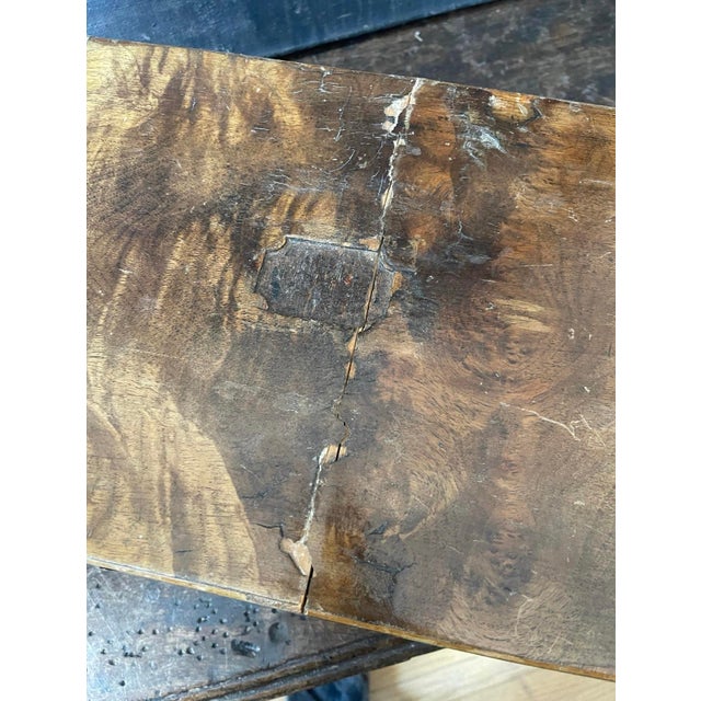 Stunning 1860s English lap desk, presented in Burlewood with brass accents. The the rectangular box opens to a sloped...