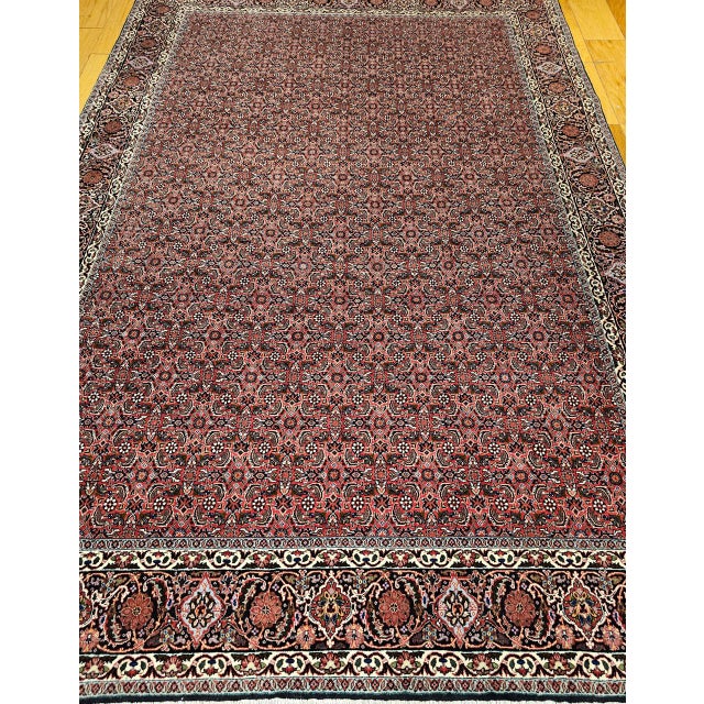 "This striking vintage Persian Bidjar rug, hand-knotted in the late 20th century, features a rare allover Herati geometric...