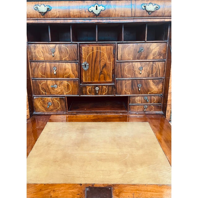 Stunning late 17th /early 18th walnut, inlaid and feather-banded escritoire with moulded cornice above a 'cushion' frieze...
