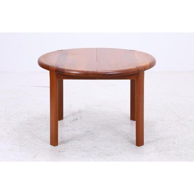 Vintage dining table by Niels Bach, crafted from warm teak with a beautiful, vibrant grain. The softly rounded tabletop...
