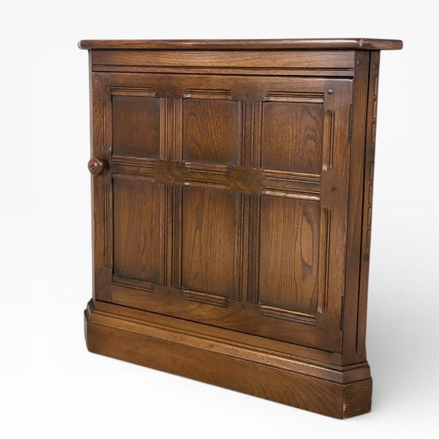 The Ercol corner cabinet is a mid century solid wood cabinet designed to maximize storage in compact spaces while...