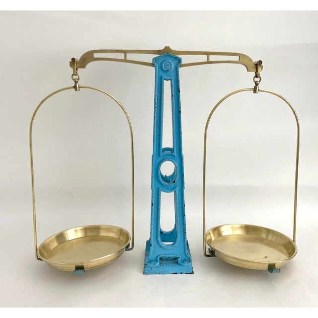 Striking French blue cast iron balance scale with original brass plates and hardware in the shape of the Eiffel Tower....