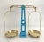 Striking French blue cast iron balance scale with original brass plates and hardware in the shape of the Eiffel Tower....