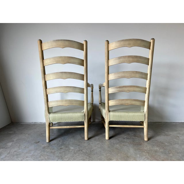 Fantastic pair of vintage high ladder back arm lounge chairs. Chic French Provincial - style upholstered seats with cream...