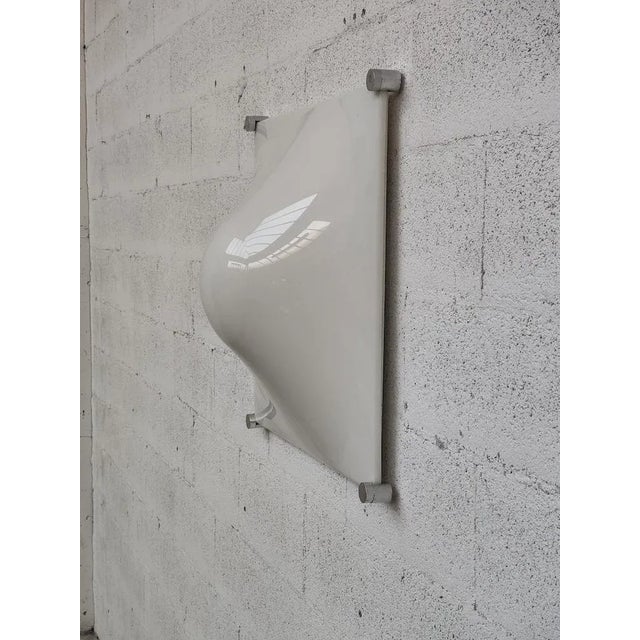 Diffused ceiling or wall lamp made of opal white methacrylate diffuser. Four corners in brushed aluminum and white...