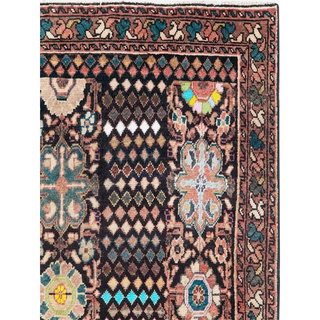 This mid-20th-century Persian Malayer gallery carpet presents a distinctive vertical composition organized into three...