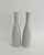 Solid hand-hewn white marble candleholders with gray veins reminiscent of bowling pins. Clean lines and one of a kind...