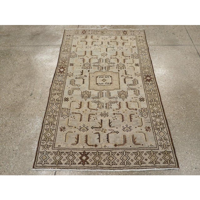 This Mid-20th century Persian Malayer rug, measuring 3' 6" x 5' 9", embodies the refined artistry for which Malayer...