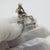 A charming and narrative driven miniature, this vintage Italian piece portrays a shoemaker at work, captured in solid...