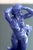 A beautiful deep cornflower blue statue of a nude woman next to a tree stump. Ceramic and made by Arthur Percy. Large size...