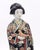A Japanese porcelain Imari courtesan with dove, late 19th century circa 1880. Bird's tail restuck.
