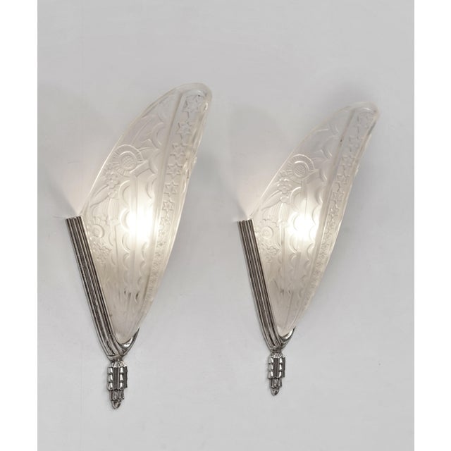 Donna Paris A beautiful pair of 1925-1930 French art deco wall sconces in nickel on cast solid brass holding shades in...