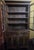 Early 19th century glazed cupboard constructed as a single-piece form in pine with a heavily worn, original painted...