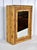 A delightful vintage tortoise bamboo single door wall cabinet with mirror, accented with grass cloth surround and one...