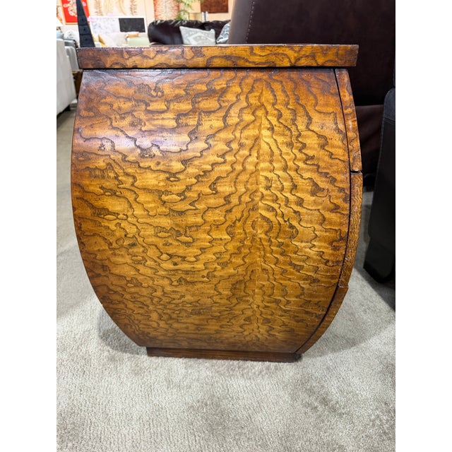 Elevate your space with the distinctive artistry of this John-Richard burl wood accent table, a striking piece that...