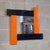 Spectacular wall mirror, with a particular black and orange modernist design, made of wood covered with plasticized paint,...