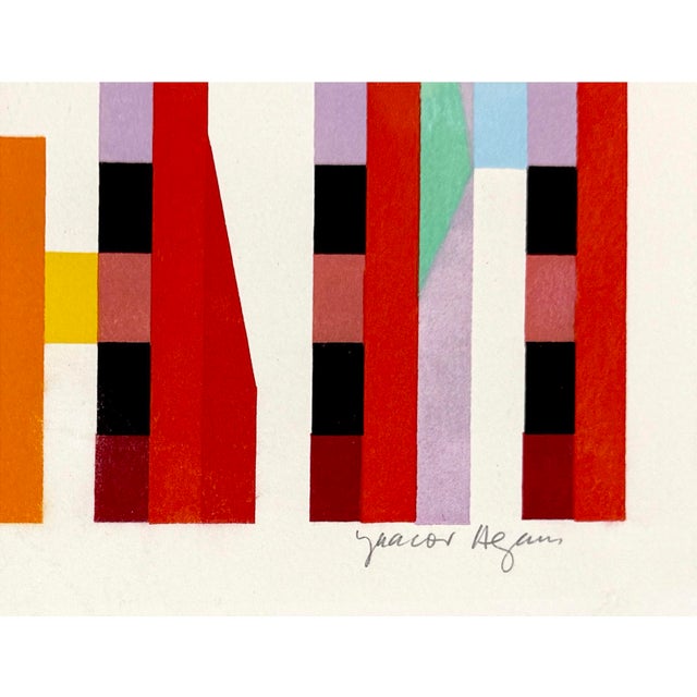 Serigraph in colors on paper. Hand signed lower right by Yaacov Agam. Hand numbered 7/150 lower left. Sheet Size: 27.5 x...