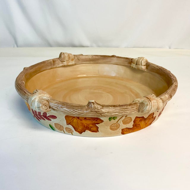 We have here a pretty Arts & Crafts ceramic Pie Dish with Fall motif. It features hand-painted leaves, berries and acorns...