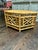 A charming Brighton Pavilion style bamboo and cane hexagonal coffee table featuring a woven cane top and decorative...