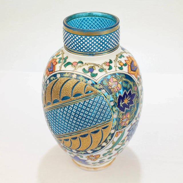 A very fine Bohemian aesthetic period enameled and cut-to-clear art glass vase. In two colors with a white cased top layer...